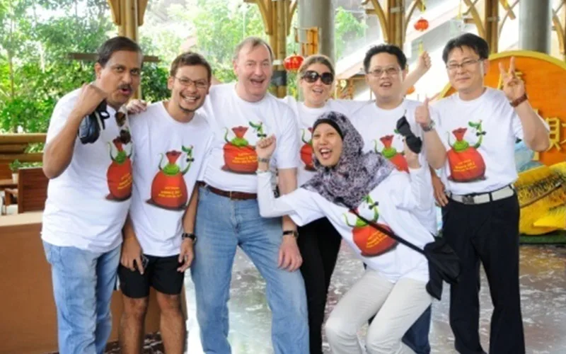 A diverse group of participants at a QOM team programme