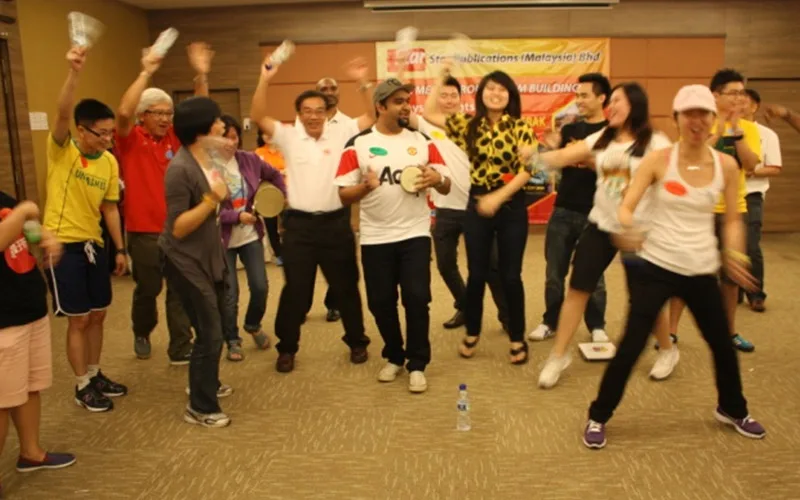 An energetic classroom activity during a QOM training programme