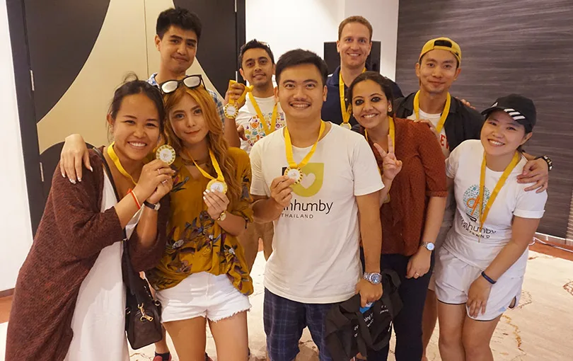 Participants with medals after completing a challenge