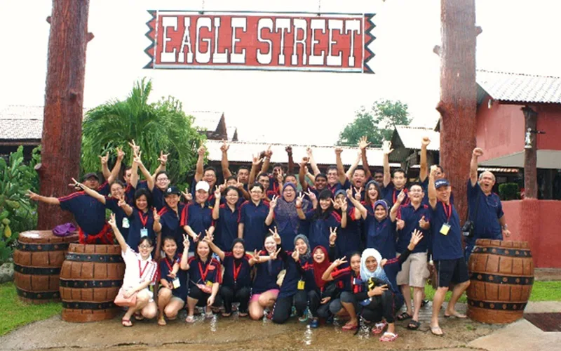 A large group photo at an outdoor venue